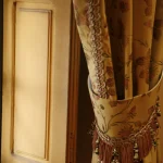 Curtain and Window Detail with Yellow and Floral Patterns