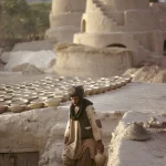 Artisan dans un village traditionnel avec des poteries
