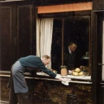 Employé nettoyant la vitrine d'un magasin